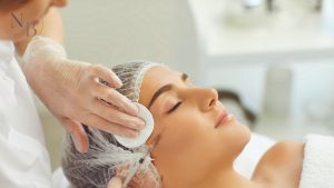 A woman receiving a Botox injection near the outer eye area to reduce crow’s feet and fine lines.