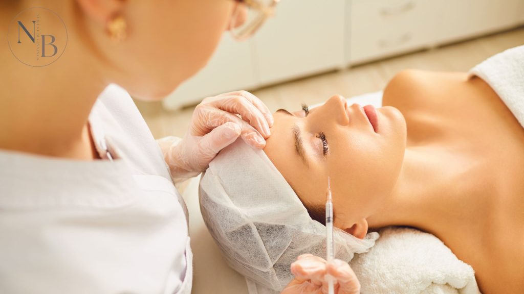 A woman receiving a Botox injection near the outer eye area to smooth wrinkles and reduce crow’s feet.